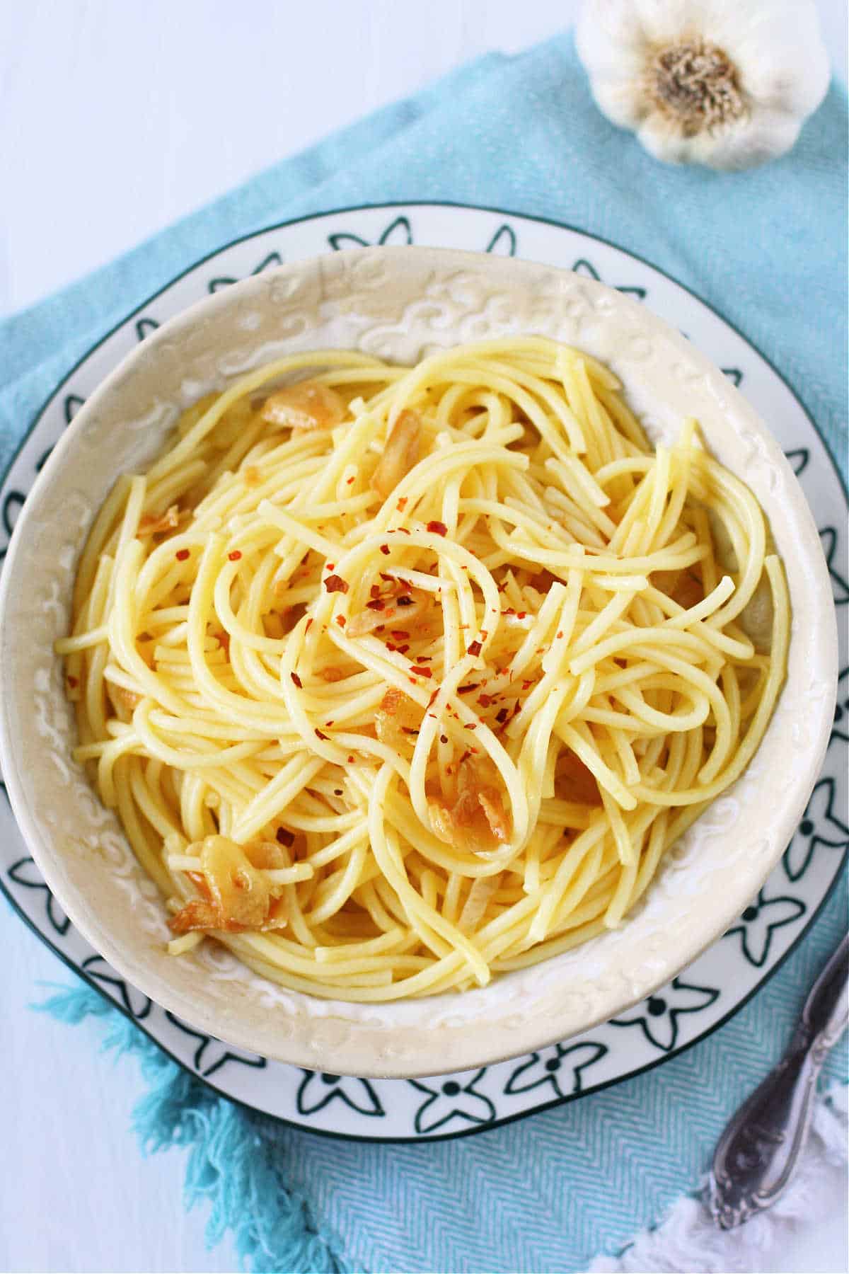 garlic spaghetti in a white bowl
