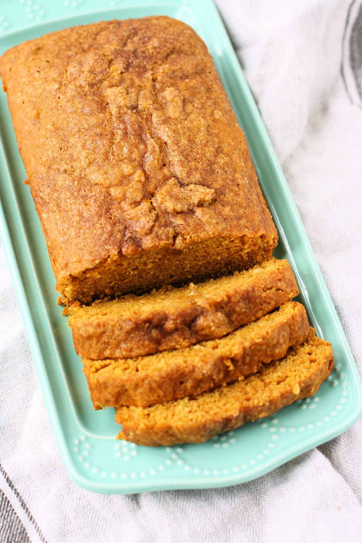 sliced vegan pumpkin bread on a tray