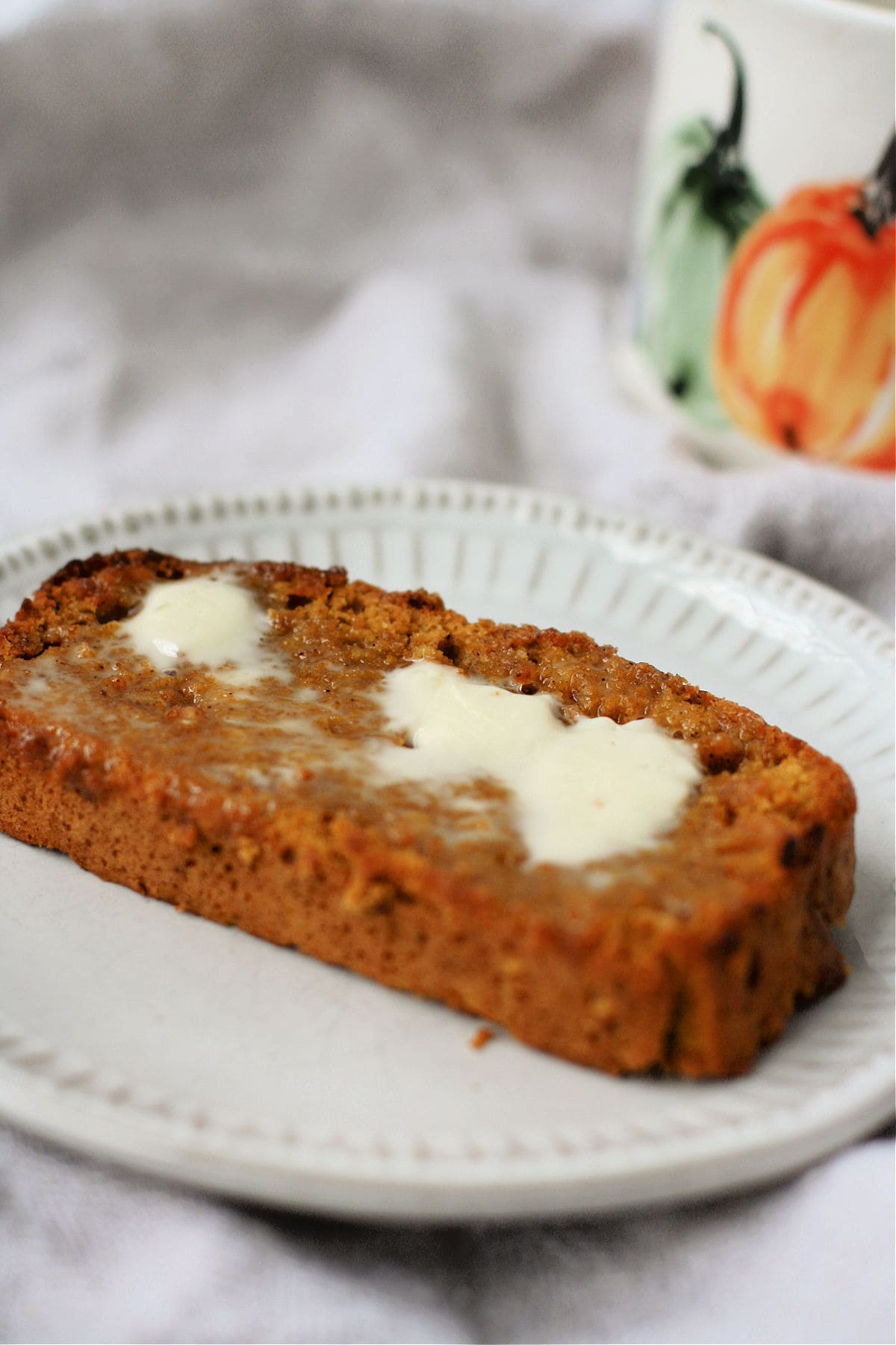 vegan pumpkin bread topped with dairy free butter