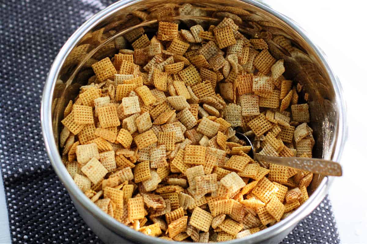 pumpkin spice chex mix in bowl before baking