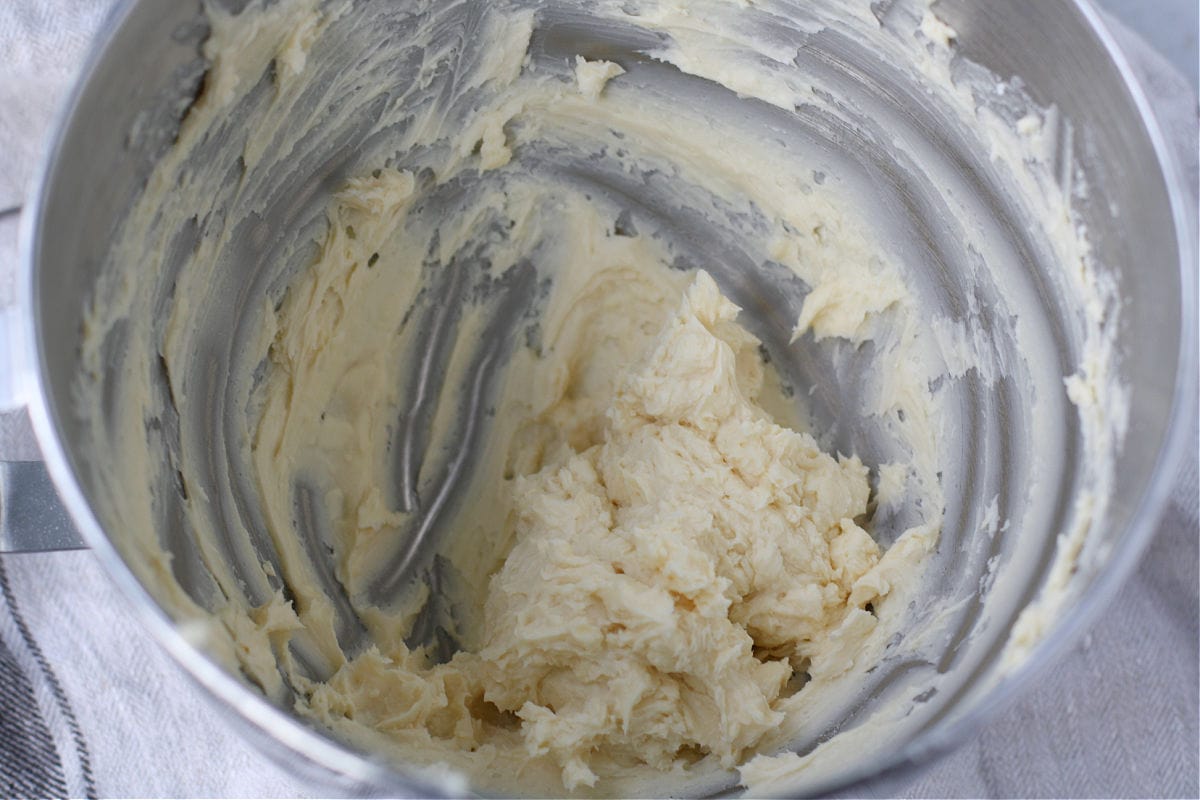 mixing powdered sugar and buttery spread together
