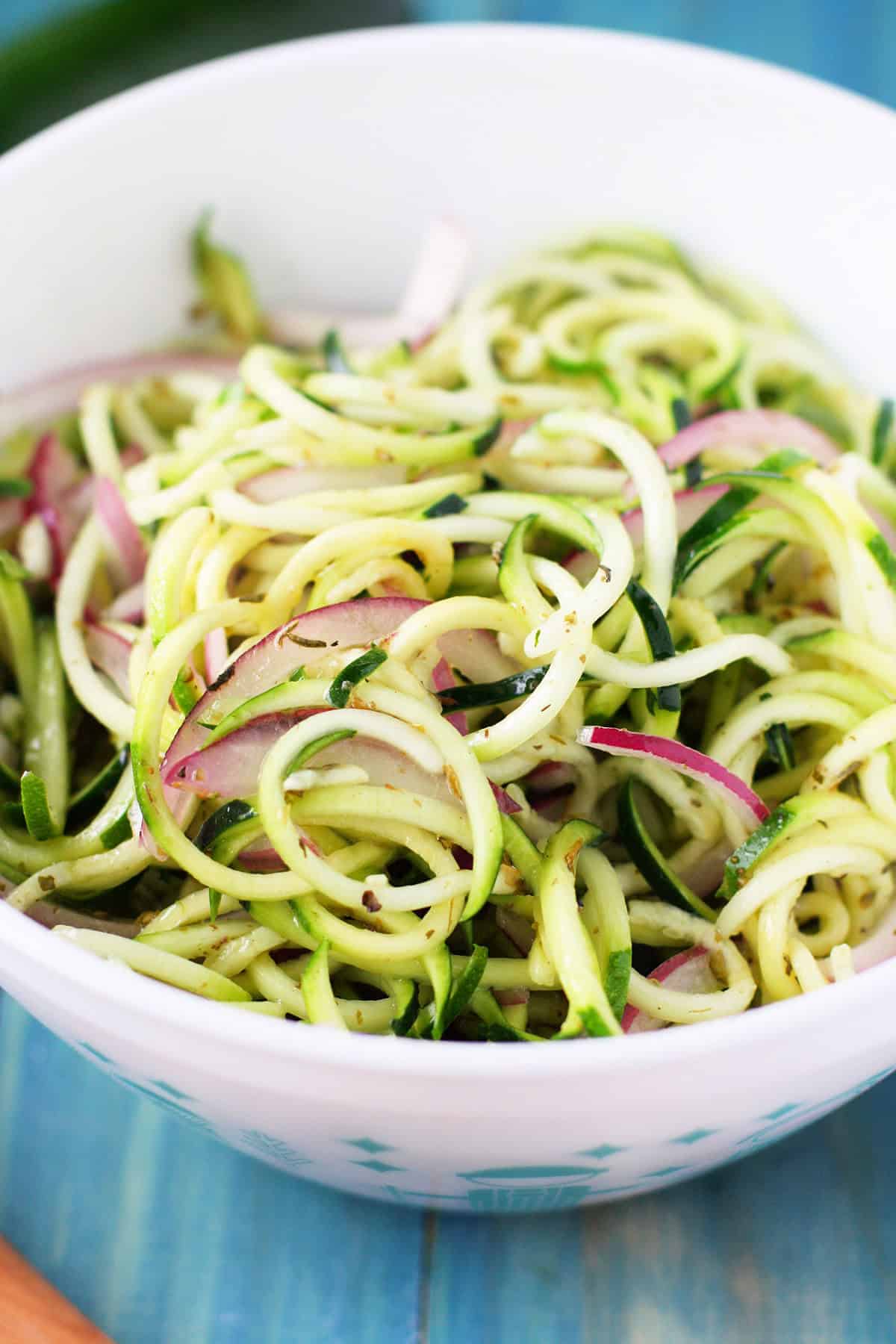 zoodle salad in a white bowl
